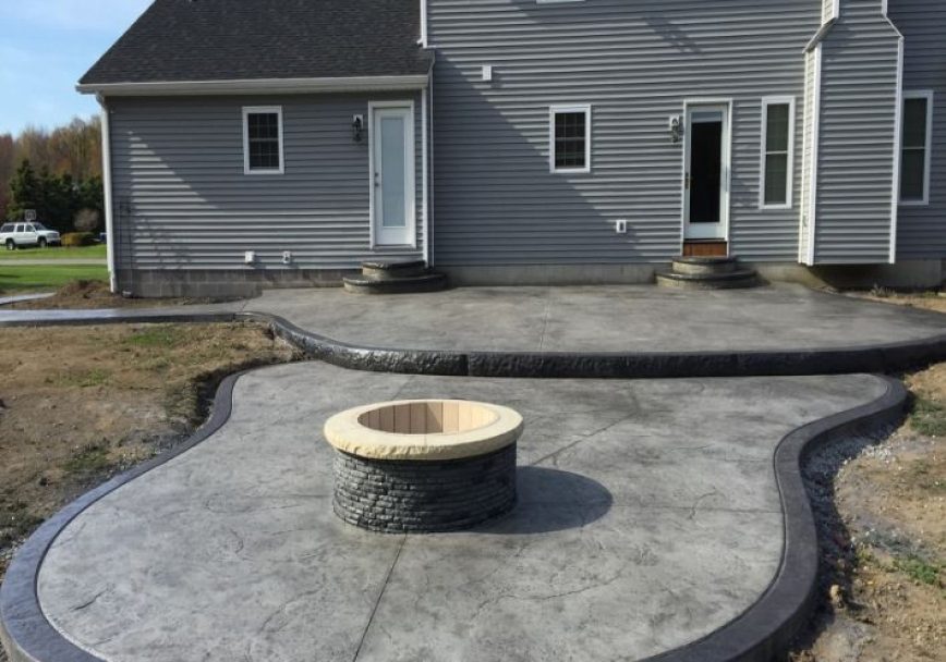 new decorative concrete patio in backyard